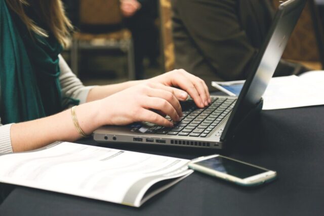 woman typing laptop